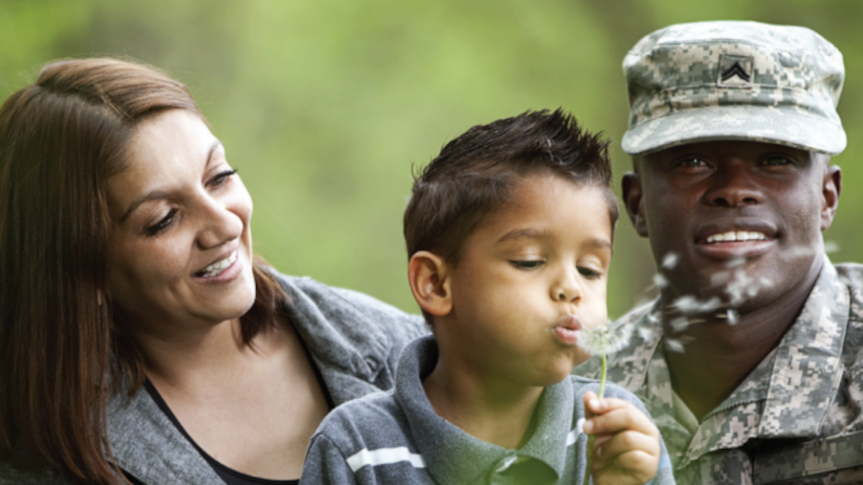 veteran in field with family